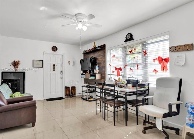 tiled dining room with ceiling fan