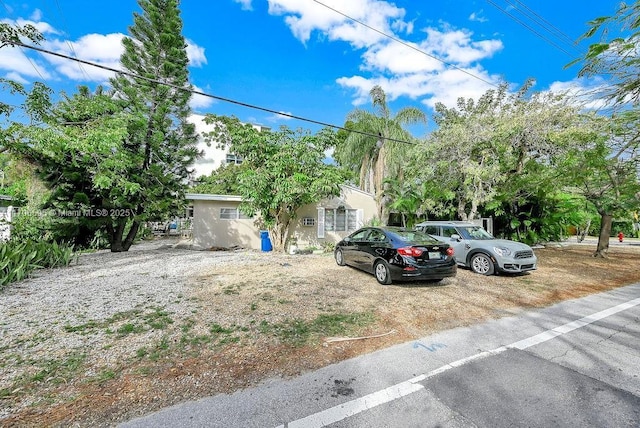 view of property hidden behind natural elements