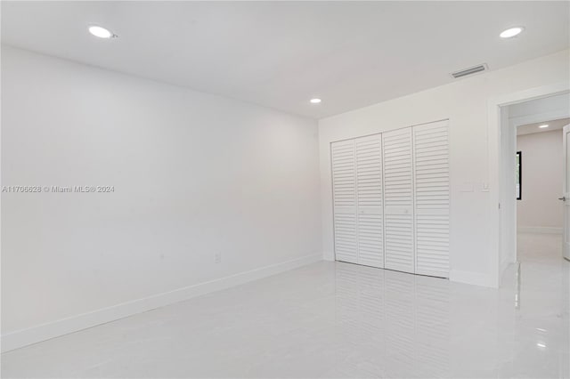 unfurnished bedroom with a closet