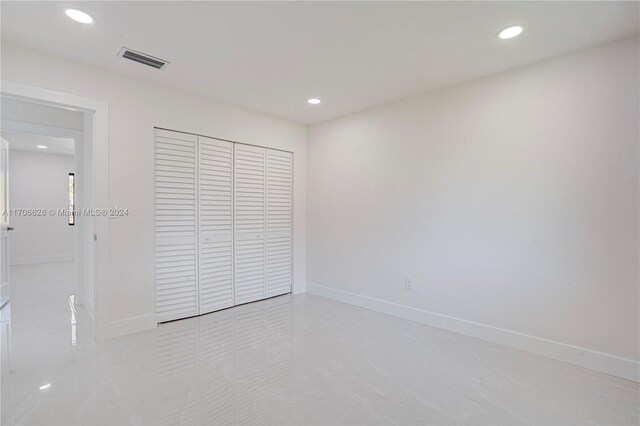 unfurnished bedroom featuring a closet