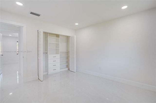 unfurnished bedroom featuring a closet