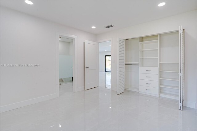 unfurnished bedroom with a closet