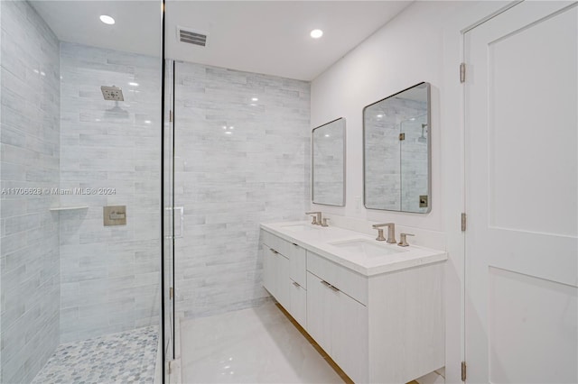 bathroom with vanity and a shower with shower door