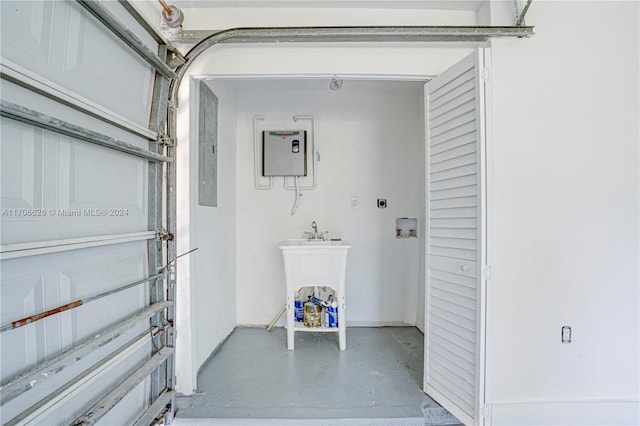 laundry area with hookup for an electric dryer, electric panel, and hookup for a washing machine