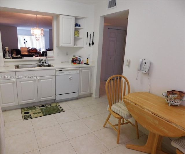 kitchen featuring white dishwasher, sink, pendant lighting, an inviting chandelier, and white cabinetry