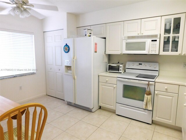 5749 Gemstone Ct Unit 307, Boynton Beach, FL 33437 - kitchen featuring white appliances, light countertops, white cabinetry, and a ceiling fan