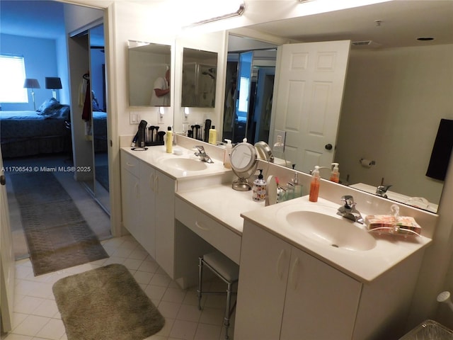 5749 Gemstone Ct Unit 307, Boynton Beach, FL 33437 - ensuite bathroom featuring double vanity and tile patterned flooring