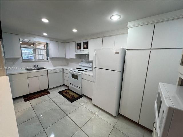 kitchen featuring white cabinetry, sink, light tile patterned floors, and white appliances