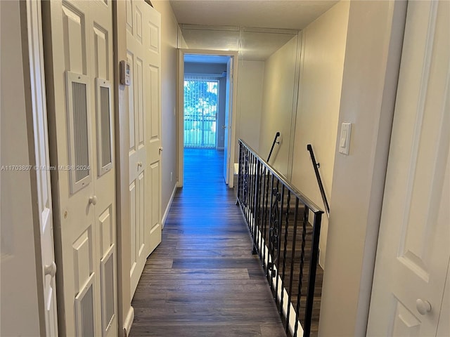 hall with dark hardwood / wood-style floors