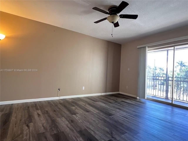 empty room featuring ceiling fan, a textured ceiling, and hardwood / wood-style flooring