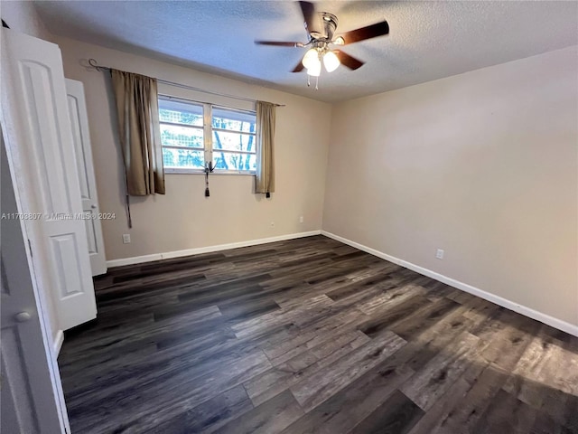 unfurnished bedroom with ceiling fan, dark hardwood / wood-style floors, and a textured ceiling