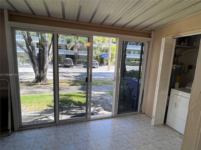 entryway featuring washer / clothes dryer and water heater