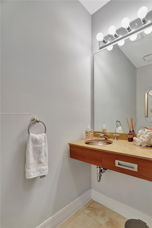 bathroom with tile patterned floors and sink