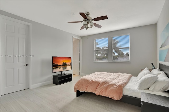 bedroom featuring light hardwood / wood-style flooring and ceiling fan