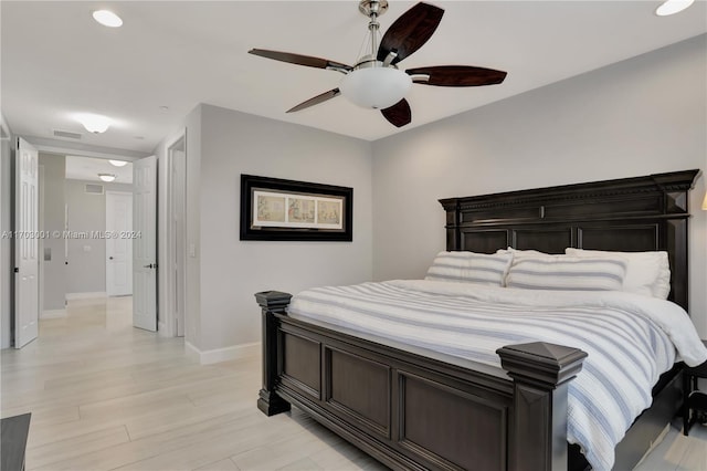 bedroom featuring light hardwood / wood-style flooring and ceiling fan