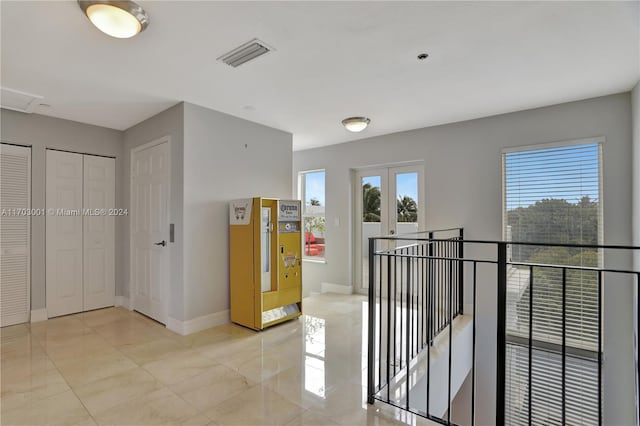 corridor featuring french doors