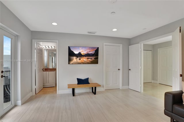 living area with light hardwood / wood-style floors