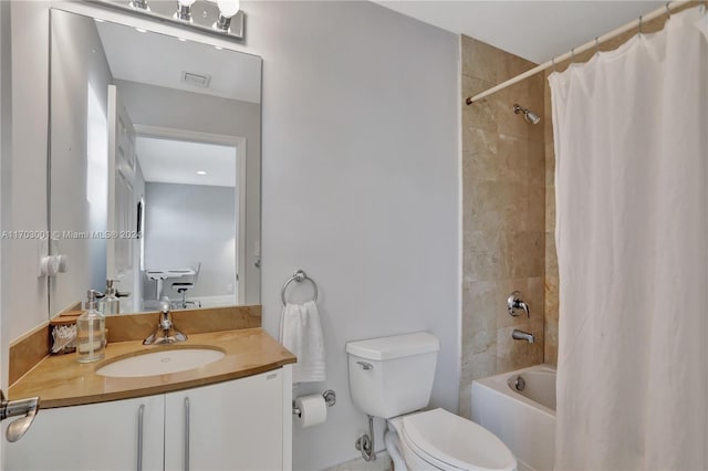 full bathroom featuring shower / bath combination with curtain, toilet, and vanity