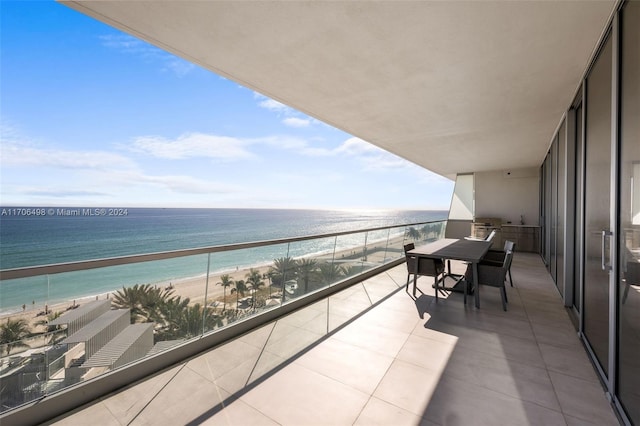 balcony with a view of the beach and a water view