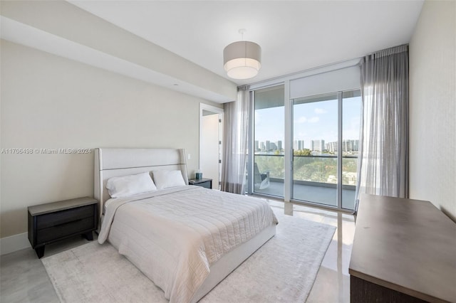 bedroom featuring access to outside and expansive windows