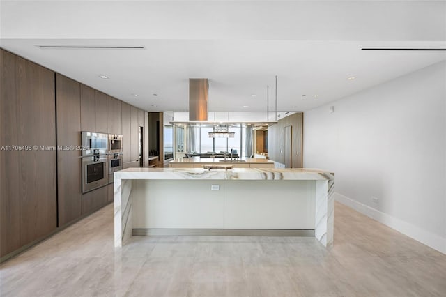 kitchen featuring dark brown cabinets, island range hood, and sink