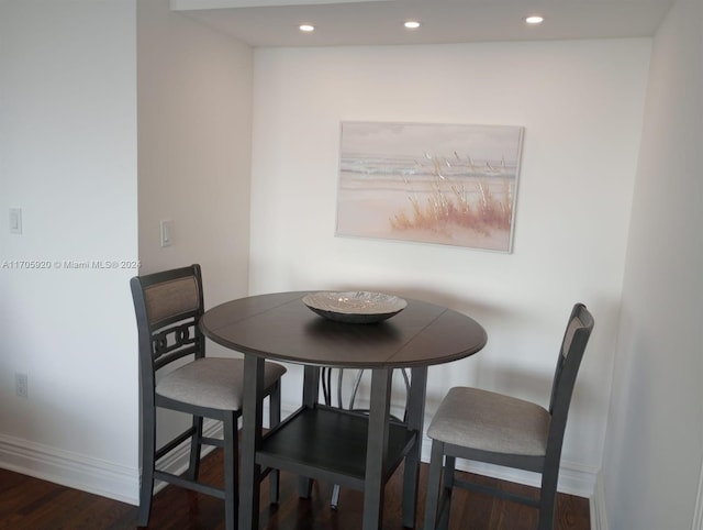 dining space featuring dark hardwood / wood-style floors