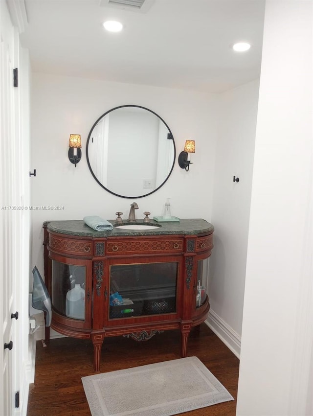 bathroom featuring vanity and hardwood / wood-style flooring