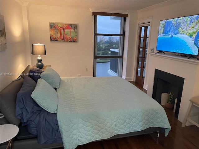 bedroom featuring hardwood / wood-style flooring and crown molding