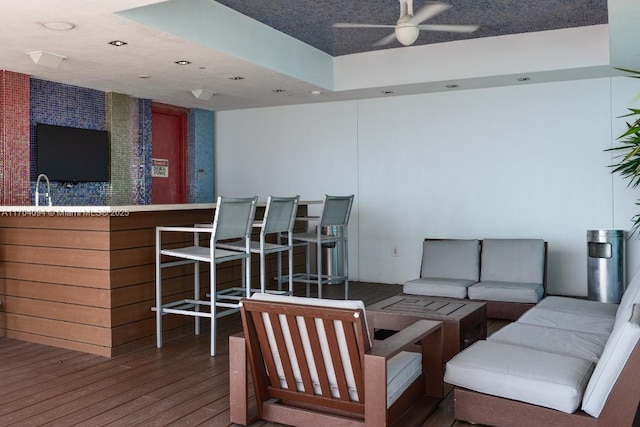 interior space featuring hardwood / wood-style flooring, sink, and ceiling fan