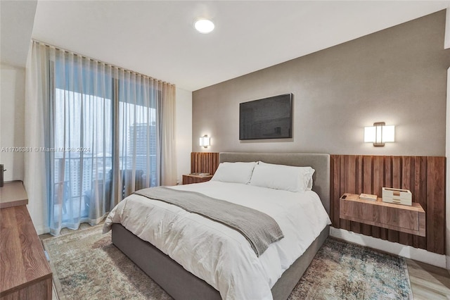 bedroom with wood-type flooring