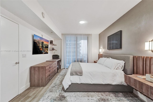 bedroom with light hardwood / wood-style flooring