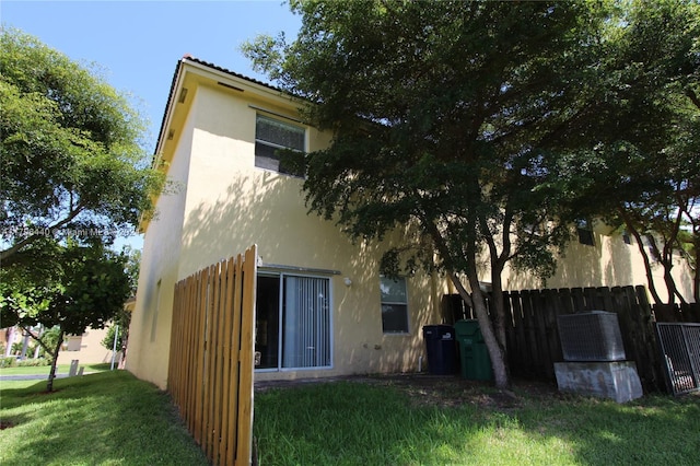 rear view of house with a lawn