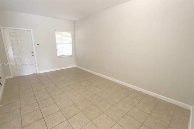 spare room featuring light tile patterned floors