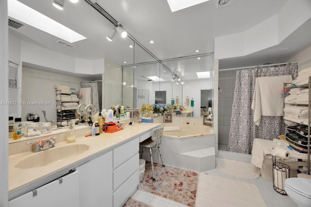 full bathroom featuring separate shower and tub, tile patterned flooring, vanity, and toilet