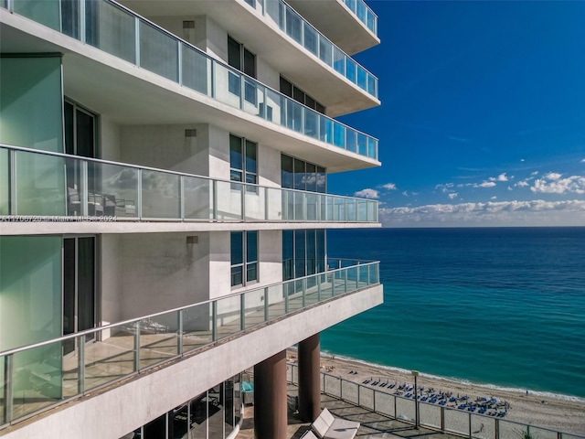 property view of water featuring a beach view