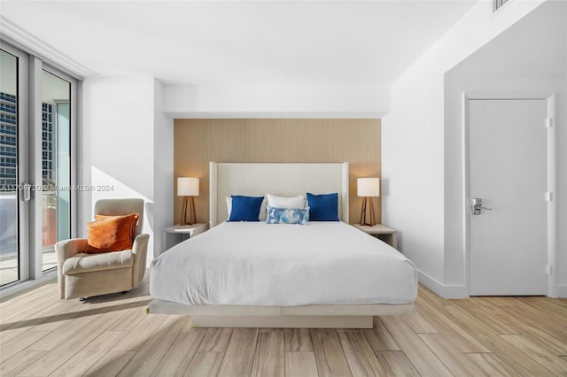 bedroom with light hardwood / wood-style flooring