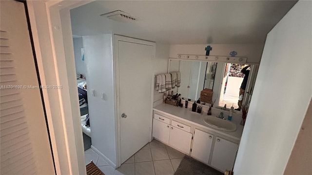 bathroom featuring vanity and tile patterned flooring