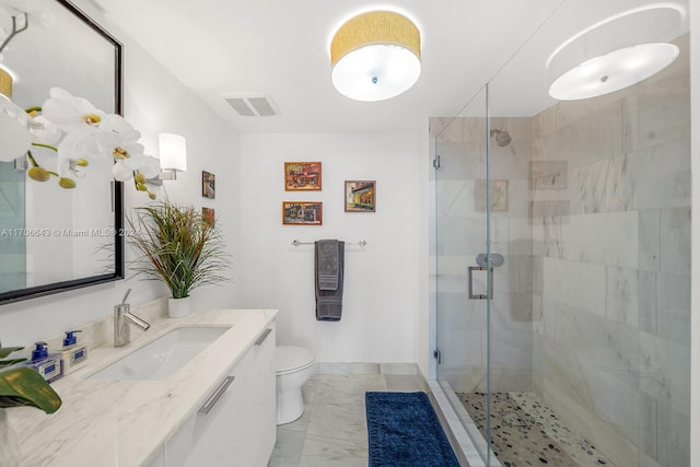 bathroom with vanity, toilet, and walk in shower