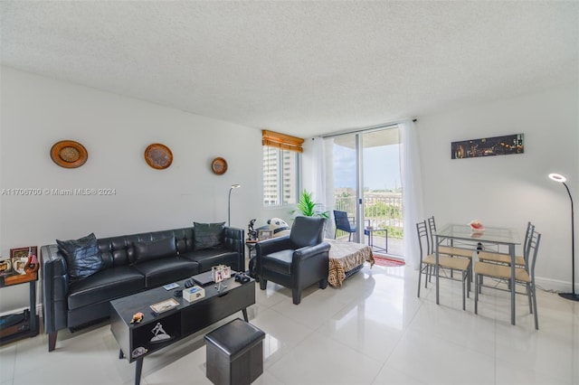 tiled living room with a textured ceiling