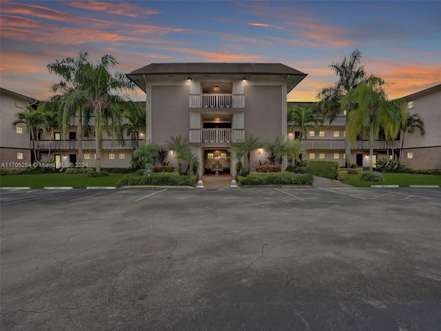 view of outdoor building at dusk