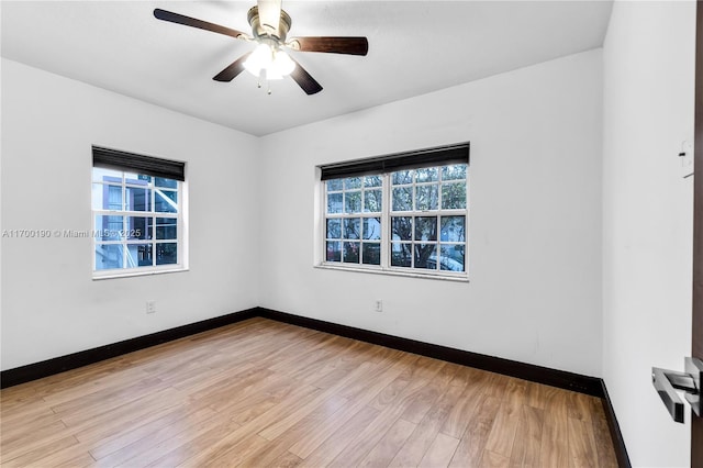 empty room featuring ceiling fan and light hardwood / wood-style floors