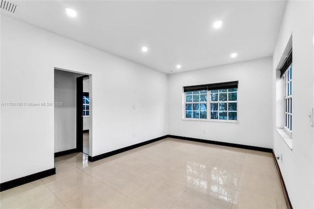 empty room featuring light tile patterned floors