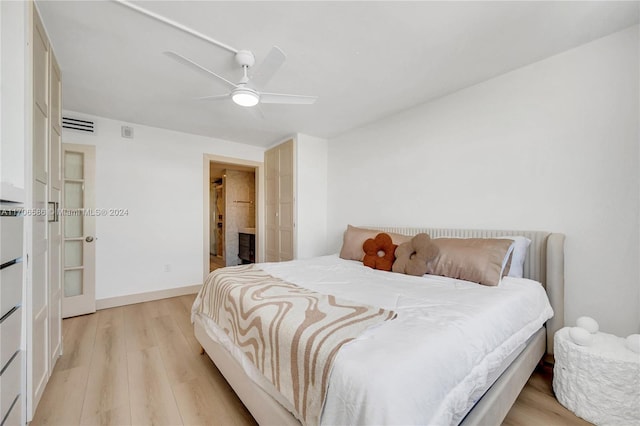 bedroom featuring ceiling fan and light wood-type flooring