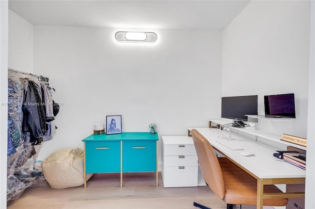 office area with light hardwood / wood-style floors