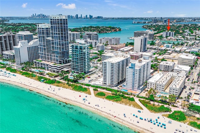 bird's eye view with a view of the beach and a water view