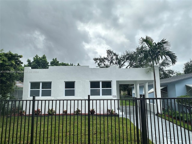 view of side of home featuring a lawn