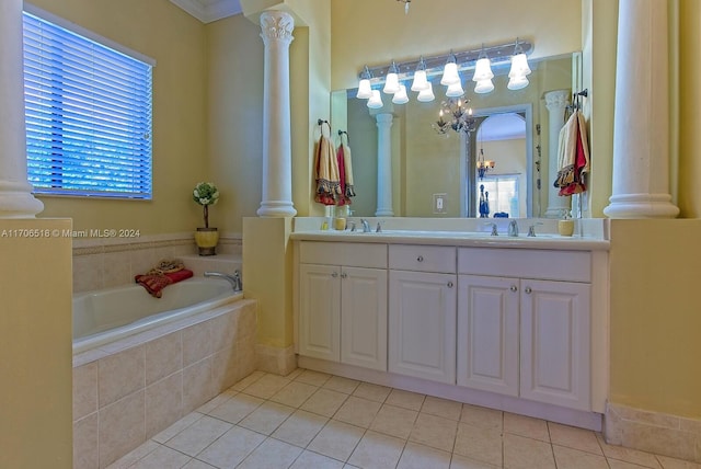 bathroom with tile patterned floors, vanity, tiled bath, and an inviting chandelier