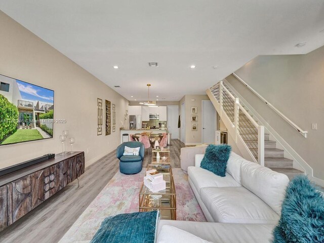 living room with light hardwood / wood-style floors