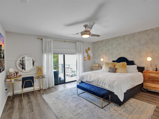 bedroom with ceiling fan, wood-type flooring, and access to exterior