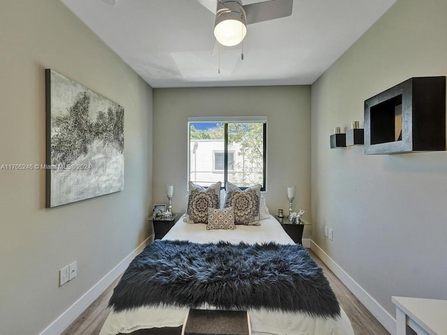 bedroom with hardwood / wood-style flooring and ceiling fan